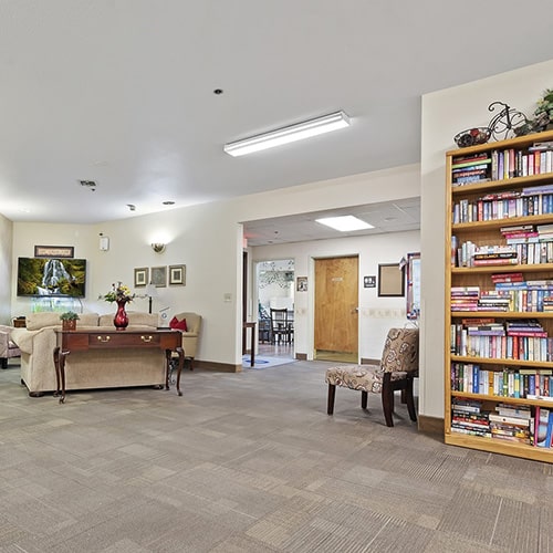 Bookshelf and sitting area at Karcher Post Acute
